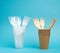 Non-degradable plastic cups and fork from disposable tableware and a set of dishes from environmental recycled materials