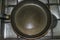 Non-stick frying pan on stainless steel gas stove. Home cooking