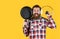 non-stick surface. chef cooking dinner. mature guy in checkered shirt with pan. stylish male going to cook food. bearded