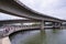 Non-stop speedway Kuril Flyover with cloudy sky and lake in Dhaka