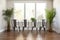 non-uniform metal chairs arranged in a minimalist dining room