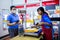 Nonthaburi, THAILAND - MAY 24, 2020 : Asian staff working at the post office with barcode reader and print slip for customer at