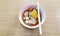 Noodle bowl placed on a wooden table.