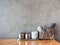 Noodle eating set, white spoons, black chopsticks, stainless steel containers, stack of white sauce bows on clean wooden table on