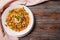 Noodle  meat,  herbs in a plate on a towel on a dark wooden ,  Asian cuisine