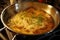noodles being added to simmering soup