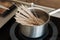 Noodles being cooked on induction stove