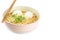 Noodles with boiled eggs in bowl and chopsticks