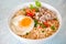 noodles bowl with boiled egg minced pork vegetable spring onion lemon on table food , instant noodles cooking tasty eating with