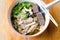 Noodles with pot-stewed duck in bowl