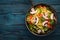 Noodles with vegetables in a frying pan. Asian Cuisine Pasta. Top view. Free space.