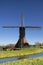 Noordeveldse windmill with a clear blue sky