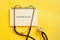 NORADRENALINE - next to a stethoscope on a yellow warm background