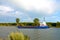 Nord-Ostsee-Kanal with cargo ship and rainbow near Rendsburg, Germany