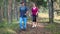 Nordic walking - active senior couple on the forest trail