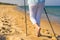 Nordic walking - beautiful woman exercising on beach