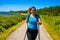 Nordic walking - beautiful woman exercising by the sea