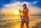 Nordic walking - beautiful woman exercising on tropical beach, Santa Maria, Sal Island, Cape Verde