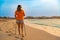 Nordic walking - beautiful woman exercising on tropical beach, Santa Maria, Sal Island, Cape Verde