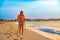 Nordic walking - beautiful woman exercising on tropical beach, Santa Maria, Sal Island, Cape Verde