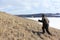 Nordic Walking - man climbing to top of a mountain Bald, Bugotaksky hills, Novosibirsk region, Russia