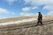 Nordic Walking - man descending from the mountain Bald, Bugotaksky hills, Novosibirsk region, Russia