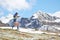 Nordic walking in the mountains in the spring downhill