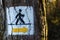 Nordic walking track sign painted on the tree in the forest
