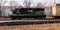 A Norfolk Southern GP33Eco diesel locomotive number 4700 in a small rail yard