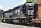 Norfolk Southern locomotives and train on siding