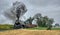 Norfolk and Western Steam Locomotive no. 611 Freight Train Blowing Smoke and Steam as it Passes a Period Farm Tractor in the