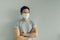 Normal face of man wearing white hygienic mask in grey t-thirt with copy space.