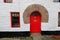 Norman arch over red door