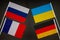 Normandy four meeting. Normandy format summit. Flags of Ukraine, Russia, Germany, France on black background. War in Donbas.