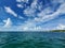 North Bimini channel and harbor under sunny summer cloudscape in Bahamas.