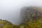 North Cape Nordkapp, on the northern coast of the island of Mageroya in Finnmark, Northern Norway on heavy foggy day .