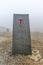 North Cape Nordkapp, on the northern coast of the island of Mageroya in Finnmark, Northern Norway on heavy foggy day .