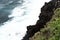 North coast of Tenerife, Canary Islands, waves breaking against dark lava rocks, view from top.