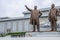 North Korean people bowing in front of Kim Il Sung and Kim Jong Il statues in Mansudae Grand Monument, Pyongyang, North Korea