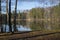 North lake in autumn forest with reflection in water