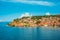 North macedonia. Ohrid. Different buildings and houses with red roofs on hill. View from lake