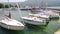 North macedonia. Ohrid. Different sail boats beside dock on lake and houses on hill on background