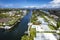 North Miami, Florida, USA - Aerial view of luxurious houses along a canal in Keystone Islands, with lush greenery