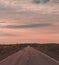 North Norway, evening with sunset on a long road near Kautokeino on a summer day