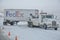 NORTH PLATTE, NEBRASKA - FEBRUARY 25, 2010 - Towing truck gets ready to pull a FedEx trailer out the icy highway