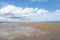 North Sea at the Crimdon beach, Hartlepool and Seaton Carew, England. Dark blue sky and sandy beach in United Kingdom