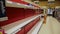 North Vancouver, Bc, Canada - Mar 15, 2020: Shelf at a supermarket mostly empty with only a few packages of toilet paper