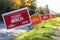 NORTH VANCOUVER, BC, CANADA - OCT 10, 2019: MP candidate signs beside the road rallying for voter support for their