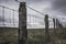 North Wales landscape,rustic fence,dramatic sky.