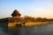 North-west tower in Forbidden City, Beijing. Winter scene captured in the glow of the setting sun.